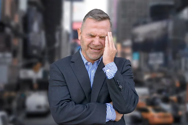 Stressed Businessman Suffering Headache Standing His Hand His Temple Grimacing — Stock Photo, Image