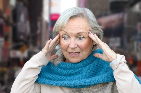 Confused Bewildered Senior Lady Holding Her Hands Her Temples She — Stock Photo, Image