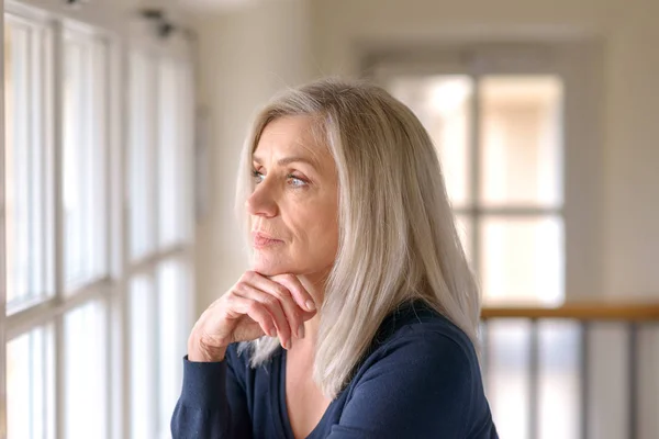 Attractive Thoughtful Woman Serious Expression Standing Her Hand Her Chin — Stock Photo, Image