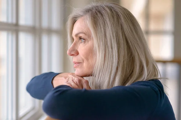 Attractive Blond Woman Watching Window Serious Expression Resting Her Chin — Stock Photo, Image