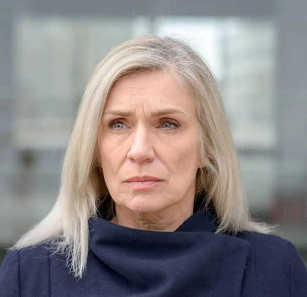 Troubled Middle Aged Blond Woman Looking Frown Faraway Expression Outdoors — Stock Photo, Image