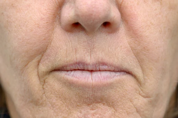 Closeup on the mouth of a woman — Stock Photo, Image