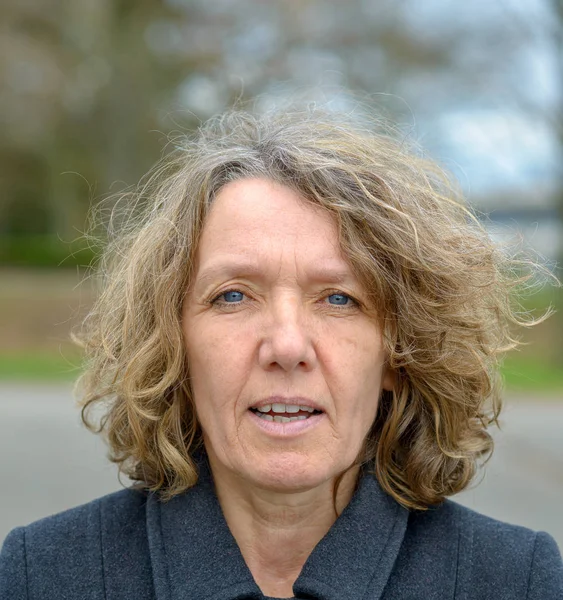 Middle aged woman front portrait with open mouth — Stock Photo, Image