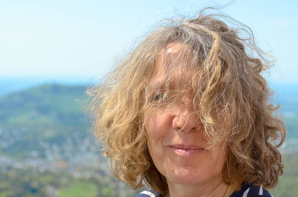 Attractive woman with tousled curly hair — Stock Photo, Image