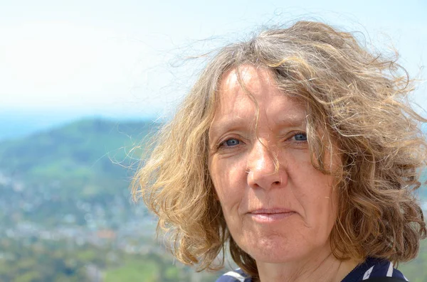 Portrait of a middle-aged woman in a windy day — Stock Photo, Image