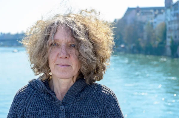 Woman with curly tousled hair outdoors — Stock Photo, Image