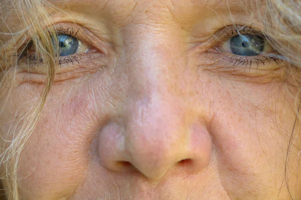 Close up on the eyes and nose of a senior woman — Stock Photo, Image