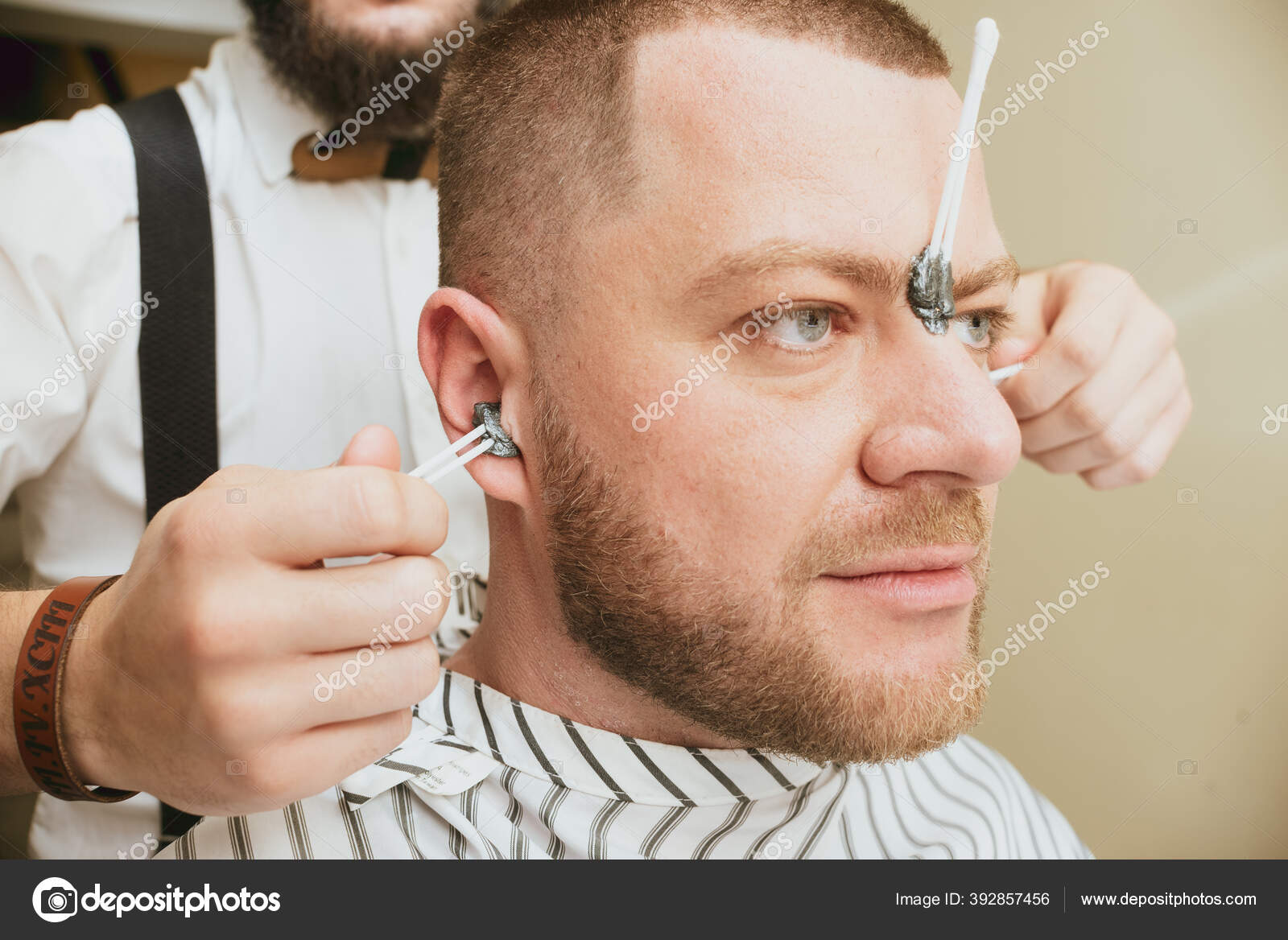 Waxing Hair Removal Ears Pulling Hair Ears Stock Photo by ©Salomonus