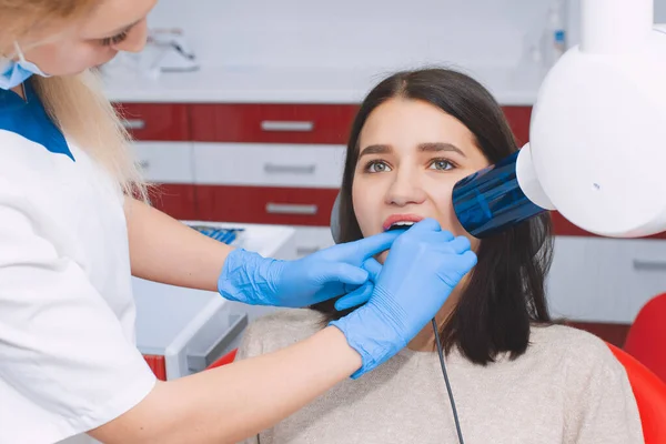 Tooth x-ray in the dental office. Young girl at the dentist\'s appointment.