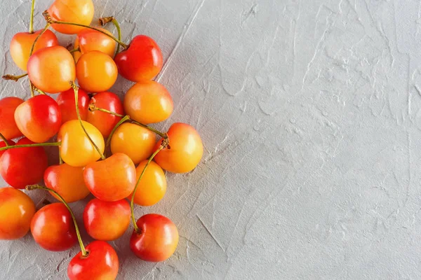 Ripe yellow-red cherry berries macro close-up.  Juicy berries, diet, healthy lifestyle.