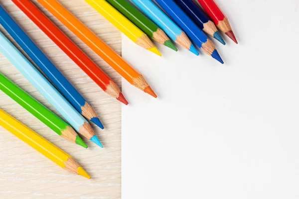 Set of colored pencils. Colors of rainbow. Colored pencils for drawing different colors on a white background.
