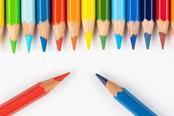 Set of colored pencils. Colors of rainbow. Colored pencils for drawing different colors on a white background.