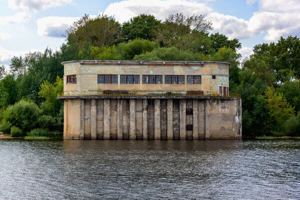 Old building by the river in summer.