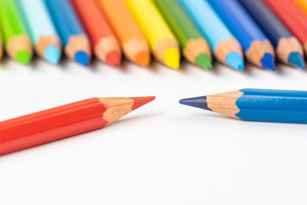 Set of colored pencils. Colors of rainbow. Colored pencils for drawing different colors on a white background.