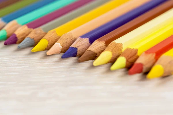 Set of colored pencils. Colored pencils for drawing different colors on a light background.