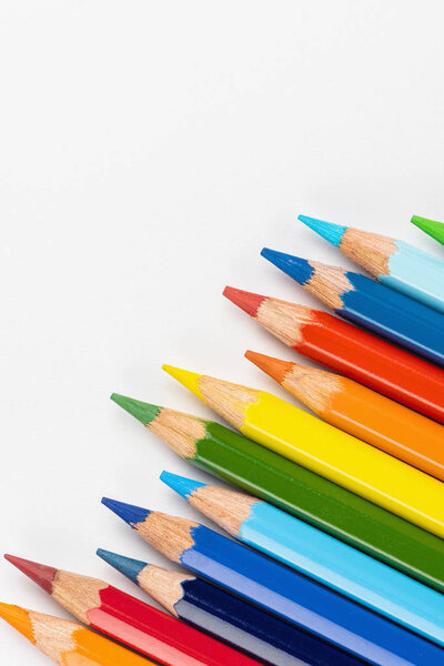 Set of colored pencils. Colors of rainbow. Colored pencils for drawing different colors on a white background.