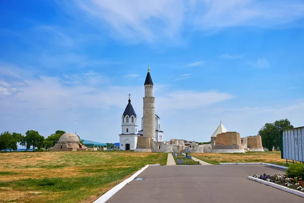 The minaret of the mosque and the Orthodox Church in the Bulgar historical and archaeological monument near Kazan.