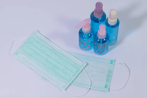 Sanitary mask with alcohol gel to wash hands Prevent coronavirus or covic-19 pathogens. White background scene