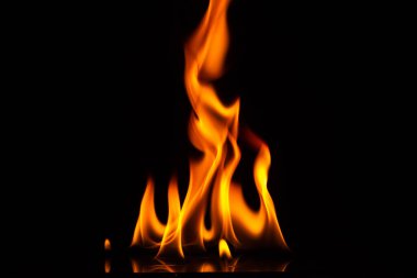 Close-up shot of a black background flame