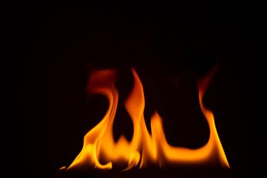 Close-up shot of a black background flame