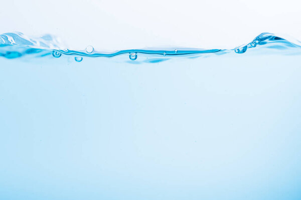 Surface of the blue water waves splash on a white background