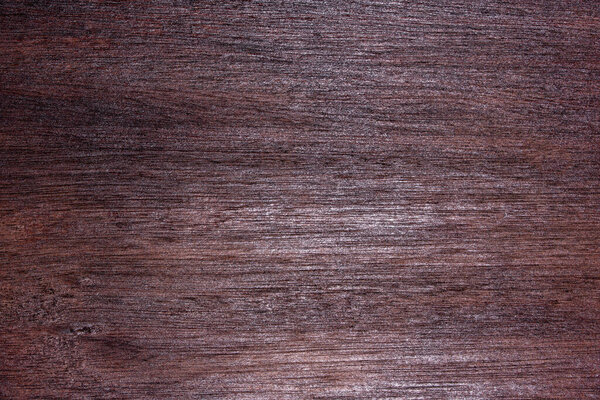 Close-up shot of red and black wood floor patterns