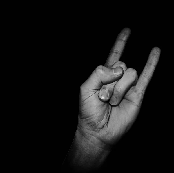 Hand gesture - two fingers up, a relaxed, festive gesture in black and white