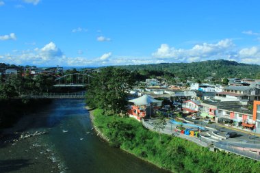 Tena, Ecuador, 18-4-2019: View of two bridges and the river napo that slices through Tena, Ecuador clipart