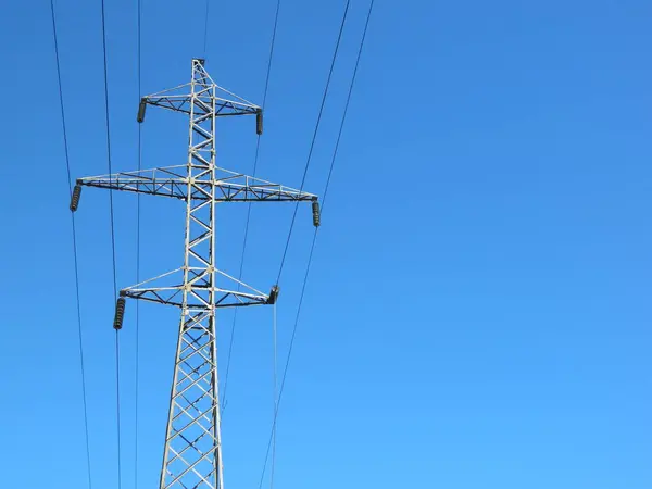 power lines against the blue sky