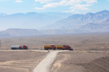 Peru Nazca august 2018 large trucks travel this road called the Pan-American that connects Lima to other smaller towns on the coast clipart
