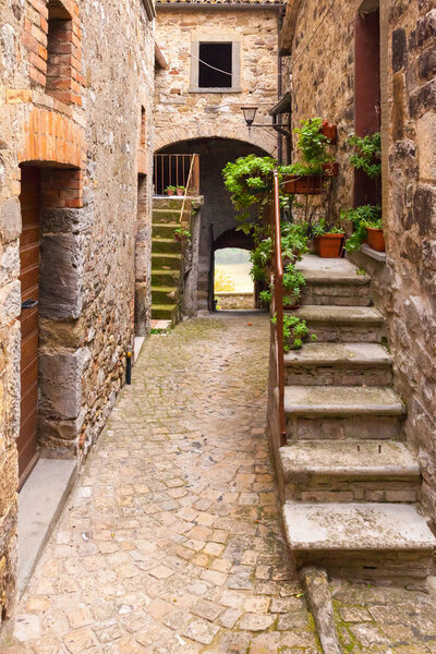 Alley of an ancient medieval village Italy