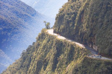 Bolivia cyclists on death road clipart