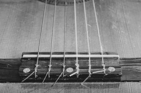 Bridge of an acoustic guitar. — Stock Photo, Image