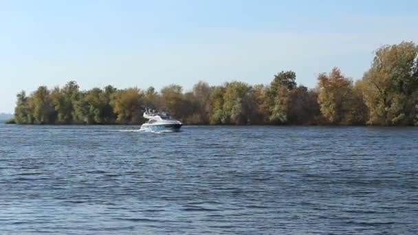 Boat Moves Slowly Channel Dam Autumn Yellow Trees Island Add — Stock Video