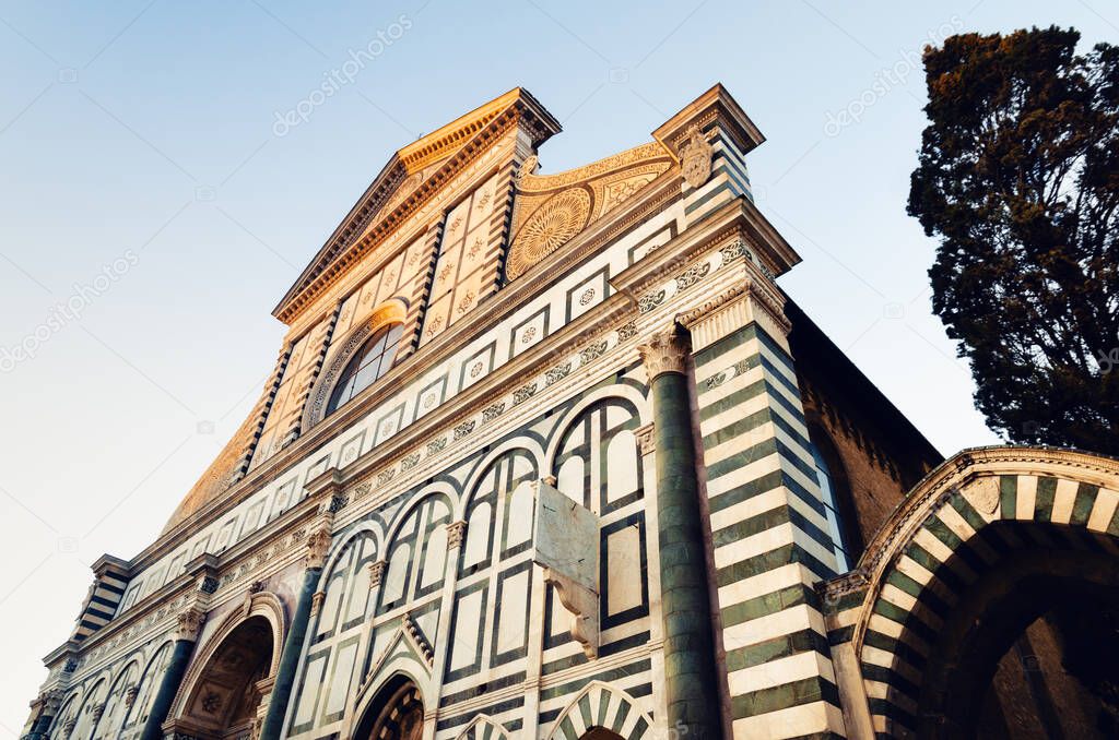 front view of the famous basilica of Santa Maria Novella, in florence (Italy) with its white and green marble facade