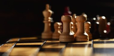 wooden chess set on chess Board