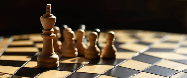 wooden chess set on chess Board