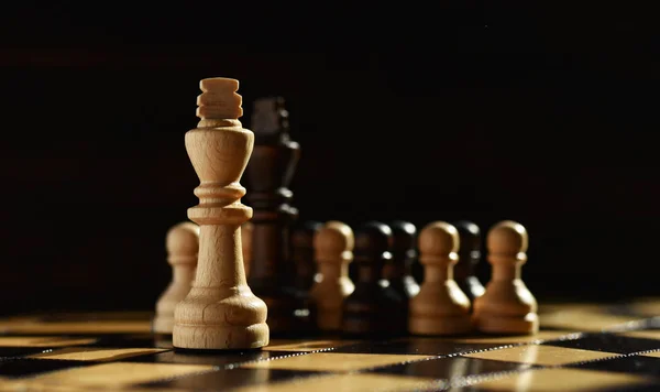 wooden chess set on chess Board