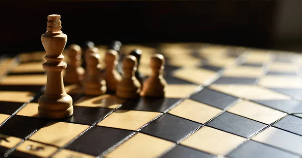 wooden chess set on chess Board