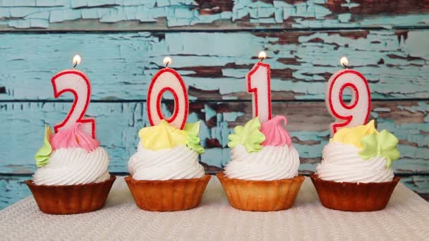 Happy New 2019 Year Number Candles Cupcakes Blue Wooden Background — Stock Video