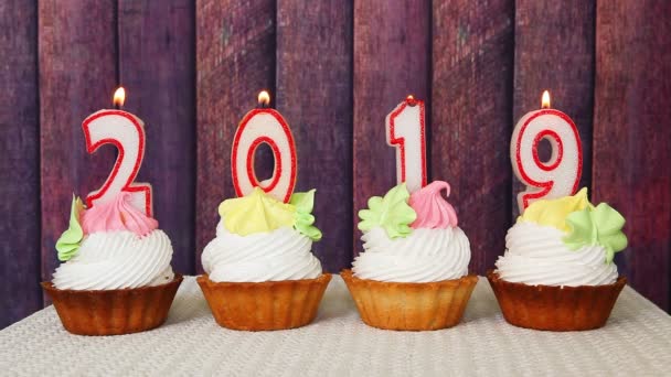 Happy New Year 2019 Number Candles Cupcakes Wooden Background — Stock Video