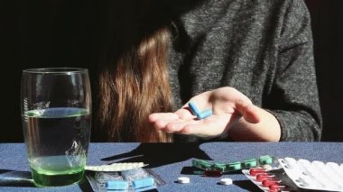 Young woman and medicine on hand, health care