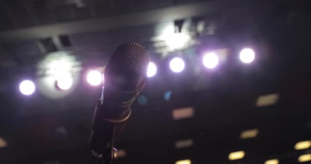 Microphone On Violet Curtain Stage Background With Light Spots — Stock Video