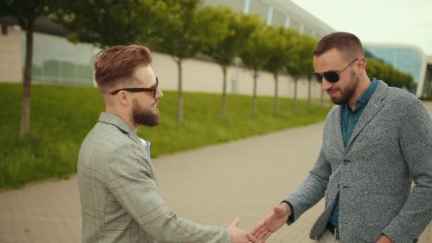 Customer, salesman with car key, estate agent giving house keys outside, people — Stock Video