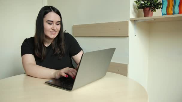 Female employee talk on video call with coworkers engaged online briefing home — Stock Video