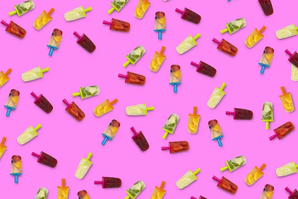Pattern of fruit popsicle on a lilac background. Strawberry, Lemon, Lemon with mint, Orange, Cherry, Multifruit. Flat lay, top view.