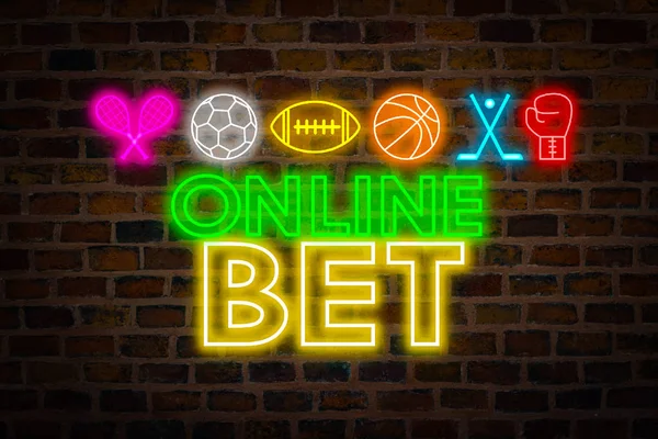 Neon signboard online bet, sports symbols, Football, American football, Basketball, Tenis, Boxing, Hockey against the backdrop of a brick wall. Concept bookmaker betting on sports online.