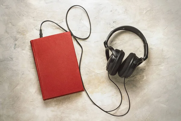 Book Headphones Connected White Stone Background Concept Audiobooks — Stock Photo, Image