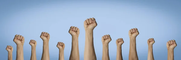 Hands Raised Clenched Fist Blue Background Concept Unity People Revolution — Stock Photo, Image