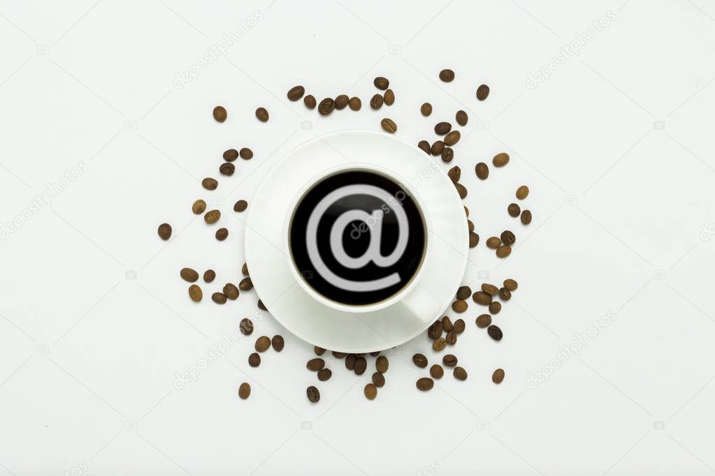 white cup with a saucer and black coffee and an Email sign, coffee grains are scattered around on a white background. Flat lay, top view.